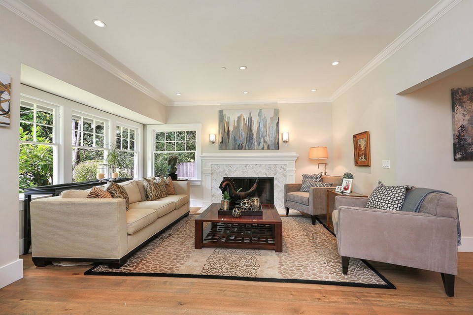 gracious and welcoming formal living room with marble fireplace