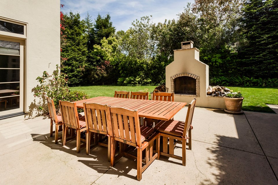 backyard features entertaining space and large grassy area