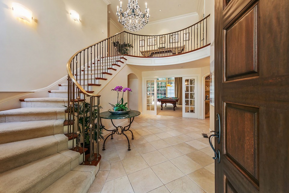 formal two-story entry with sweeping staircase