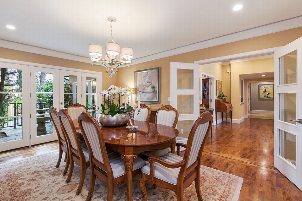 gracious formal dining room with french doors to private courtyard