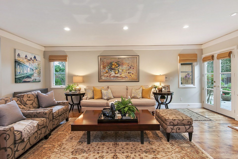 adjacent family room with french doors to pool and outdoor entertaining area