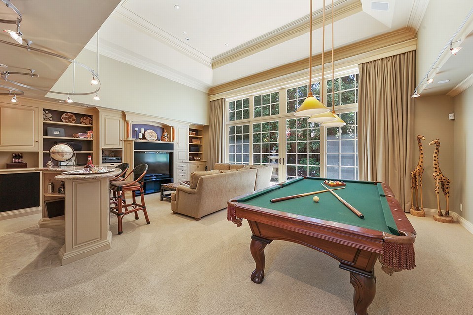 media room with 20-foot vaulted ceilings and wet bar