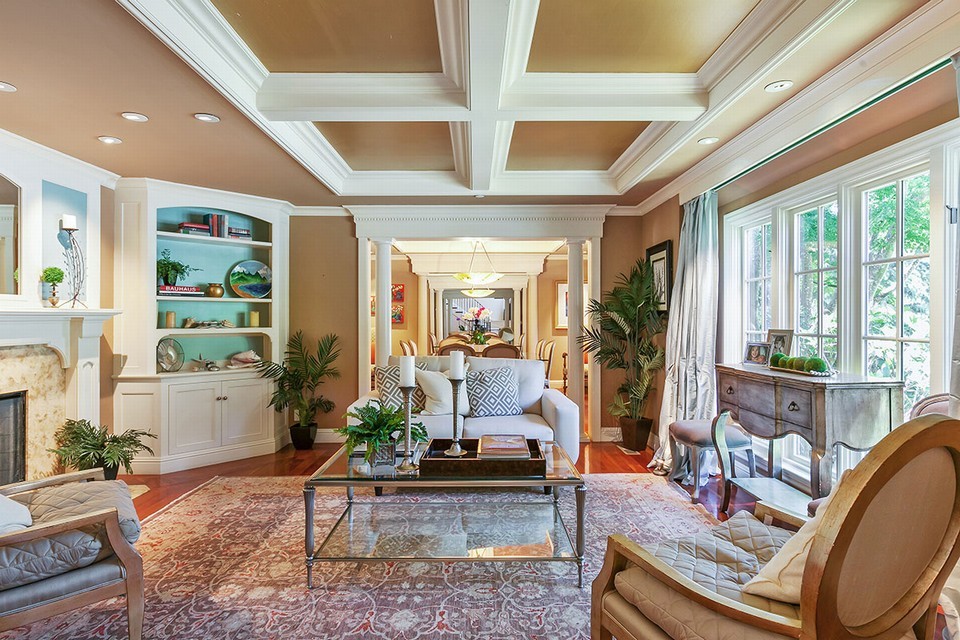 elegantly appointed living room with marble fireplace