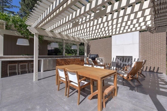 outdoor area with fireplace, perfect for entertaining guests