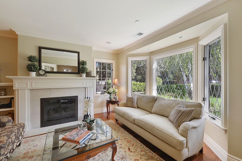 elegantly appointed living room with oversized bay windows