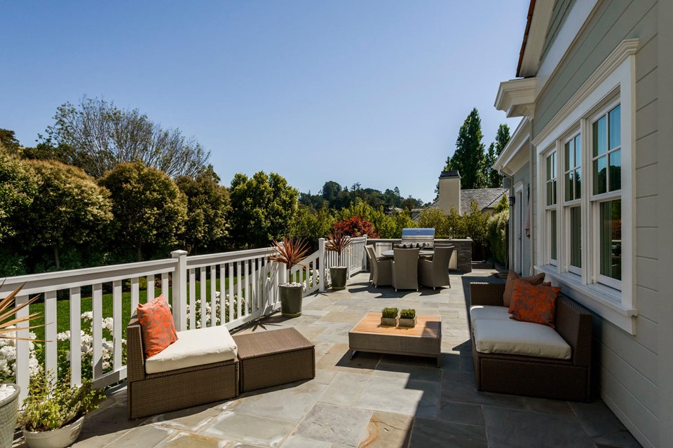 outdoor kitchen with dining area and fire pit