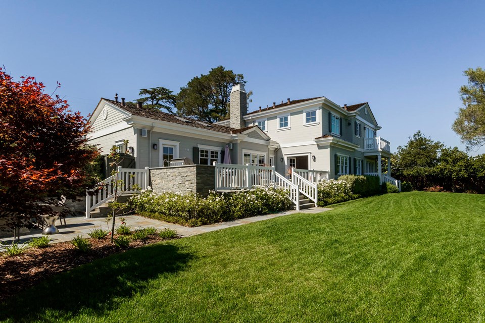 grounds feature gated entry, lush lawns, and bluestone paved pathways